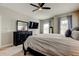 Inviting bedroom with plush carpeting, neutral walls, and a large bed at 14975 Renaissance Ave, Odessa, FL 33556
