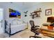 Bedroom featuring a stylish wall art, and a desk area at 14975 Renaissance Ave, Odessa, FL 33556