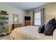 Well-lit bedroom boasts a plush bed, stylish decor, and ample storage space at 14975 Renaissance Ave, Odessa, FL 33556