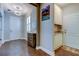 Welcoming entryway featuring wood flooring, white cabinets, and a decorative light fixture at 14975 Renaissance Ave, Odessa, FL 33556