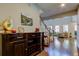 Inviting entryway with wood floors, a staircase, and a view into the living area at 14975 Renaissance Ave, Odessa, FL 33556