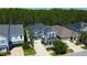 Charming two-story home with a well-manicured lawn and a welcoming covered front porch at 14975 Renaissance Ave, Odessa, FL 33556