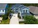 Charming two-story home with a two-car garage, manicured landscaping, and great curb appeal at 14975 Renaissance Ave, Odessa, FL 33556
