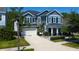Beautiful two-story home with a manicured lawn, a two car garage, and elegant landscaping at 14975 Renaissance Ave, Odessa, FL 33556