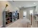 Open hallway featuring stylish built-in shelving and neutral walls at 14975 Renaissance Ave, Odessa, FL 33556