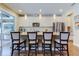 Bright kitchen features white cabinets, granite countertops, stainless steel appliances, and an island with bar seating at 14975 Renaissance Ave, Odessa, FL 33556