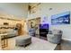 A spacious living room with an open floor plan adjacent to a kitchen and staircase, offering a seamless flow at 14975 Renaissance Ave, Odessa, FL 33556