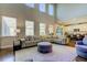 The great room has soaring ceilings, large windows and an open floor plan at 14975 Renaissance Ave, Odessa, FL 33556