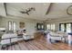 A comfortable lounge area featuring plush seating, wood flooring, and natural light, ideal for relaxation and socializing at 14975 Renaissance Ave, Odessa, FL 33556
