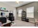Well-lit office space with modern desk, shelves, and two large windows at 14975 Renaissance Ave, Odessa, FL 33556