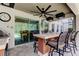 This covered bar is adjacent to kitchen with entertainment options overlooking the pool area at 14975 Renaissance Ave, Odessa, FL 33556