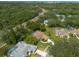 Wonderful overhead of a residential neighborhood with mature trees, green lawns, and beautiful single-Gathering homes at 1551 Mcauliffe Ln, Palm Harbor, FL 34683