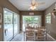 Dining area overlooking lanai and pool area at 1551 Mcauliffe Ln, Palm Harbor, FL 34683