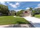 Beautiful single-Gathering home with well-maintained lawn, landscaping and a two-car garage at 1551 Mcauliffe Ln, Palm Harbor, FL 34683