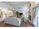 Well-lit living room boasts high ceilings, hardwood floors, fireplace, and access to the pool area at 1551 Mcauliffe Ln, Palm Harbor, FL 34683
