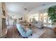Spacious living room featuring vaulted ceilings, a cozy fireplace, and an open layout perfect for relaxation at 1551 Mcauliffe Ln, Palm Harbor, FL 34683