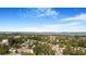 Expansive aerial view of a neighborhood with water and city skyline in the background under a blue sky with scattered clouds at 1625 Fulton Ave, Clearwater, FL 33755