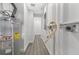 Utility room featuring modern water heater and electrical panel at 1625 Fulton Ave, Clearwater, FL 33755