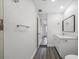 Bathroom featuring modern gray floors, white cabinets, and a sleek countertop sink at 1625 Fulton Ave, Clearwater, FL 33755