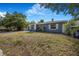 Single-story home featuring a well-maintained lawn at 1625 Fulton Ave, Clearwater, FL 33755