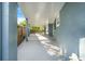 Covered patio showcasing the home's exterior and a fenced yard at 1625 Fulton Ave, Clearwater, FL 33755