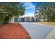 Charming single-story home featuring a well-maintained lawn and a driveway at 1625 Fulton Ave, Clearwater, FL 33755