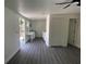 Versatile flex space showcasing new floors, ample lighting, and outdoor access at 1625 Fulton Ave, Clearwater, FL 33755
