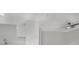 The modern kitchen features gray countertops, stainless steel sink, and white cabinets at 1625 Fulton Ave, Clearwater, FL 33755