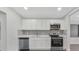 Modern kitchen featuring sleek appliances, beautiful cabinetry, and a stylish backsplash at 1625 Fulton Ave, Clearwater, FL 33755