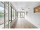 Bright and airy sunroom with tile floors, surrounded by windows offering abundant natural light at 1625 Fulton Ave, Clearwater, FL 33755