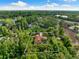 Aerial view of large lot home surrounded by mature greenery at 17347 Linda Vista Cir, Lutz, FL 33548