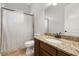 Clean bathroom featuring a granite countertop, wood vanity, and shower-tub combo at 17347 Linda Vista Cir, Lutz, FL 33548