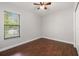 Empty bedroom with hardwood floors, natural light, and closet at 17347 Linda Vista Cir, Lutz, FL 33548