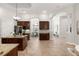Open-concept kitchen with granite countertops, wooden cabinets, stainless steel appliances and a center island at 17347 Linda Vista Cir, Lutz, FL 33548