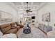 Expansive living room with open floor plan, fireplace, and views of the sunroom at 17347 Linda Vista Cir, Lutz, FL 33548