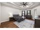 Main bedroom with dark furnishings and wood floors at 17347 Linda Vista Cir, Lutz, FL 33548
