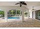 Beautiful pool with overhead fans and outdoor access at 17347 Linda Vista Cir, Lutz, FL 33548