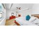 Bright bedroom featuring modern wood furniture, large windows, and tray ceiling at 17529 Buckingham Garden Dr, Lithia, FL 33547