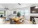 Bright dining room featuring a modern chandelier and an open layout, perfect for entertaining at 17529 Buckingham Garden Dr, Lithia, FL 33547