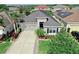 Aerial shot showcasing the front of this attractive single-Gathering home with a well-manicured lawn at 17529 Buckingham Garden Dr, Lithia, FL 33547