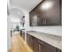 Modern kitchen with granite countertops and dark wood cabinetry at 17529 Buckingham Garden Dr, Lithia, FL 33547