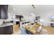 Open-concept kitchen features granite countertops and a breakfast bar that flows into the dining area at 17529 Buckingham Garden Dr, Lithia, FL 33547