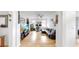 Open concept living room with light wood floors, white walls and tasteful decorations at 17529 Buckingham Garden Dr, Lithia, FL 33547