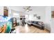 Stylish living room with a comfortable black couch, work area, and a vibrant display unit at 17529 Buckingham Garden Dr, Lithia, FL 33547