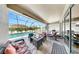 Inviting screened patio featuring a cozy seating area with a fire pit and view of the sparkling pool at 17529 Buckingham Garden Dr, Lithia, FL 33547