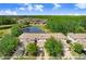 Scenic aerial view of the townhome community, highlighting the serene pond and greenery at 19281 Stone Hedge Dr, Tampa, FL 33647