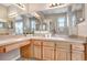Bathroom featuring a shower and bathtub, spacious vanity, and neutral color palette at 19281 Stone Hedge Dr, Tampa, FL 33647