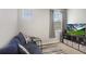 Cozy living area with a modern navy couch, neutral walls, and a convenient side table at 19281 Stone Hedge Dr, Tampa, FL 33647