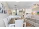 Open-concept living space with dining area, living room with fireplace, and kitchen with stainless appliances at 19281 Stone Hedge Dr, Tampa, FL 33647