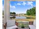 Relaxing patio area with scenic lake views, perfect for enjoying the tranquility of the outdoors at 19281 Stone Hedge Dr, Tampa, FL 33647